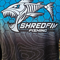 close up photo of chest of ShredFin HexCast Almafi Coast Fade performance shirt.
