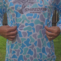 Video showing ShredFin Seaglass Camo hooded performance shirt.