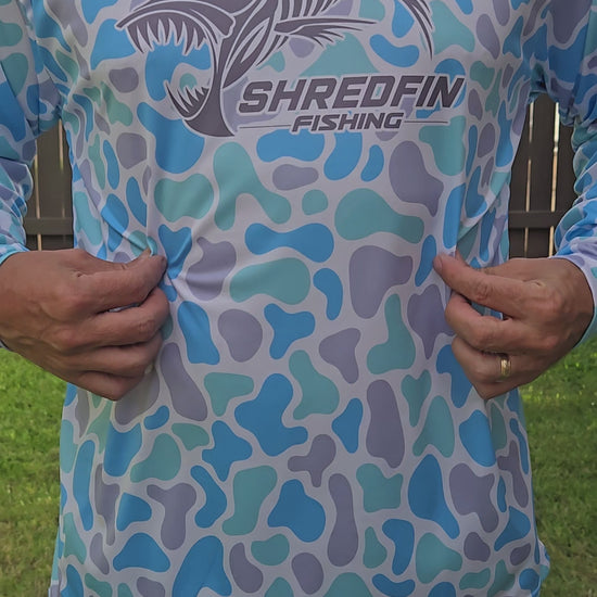 Video showing ShredFin Seaglass Camo hooded performance shirt.