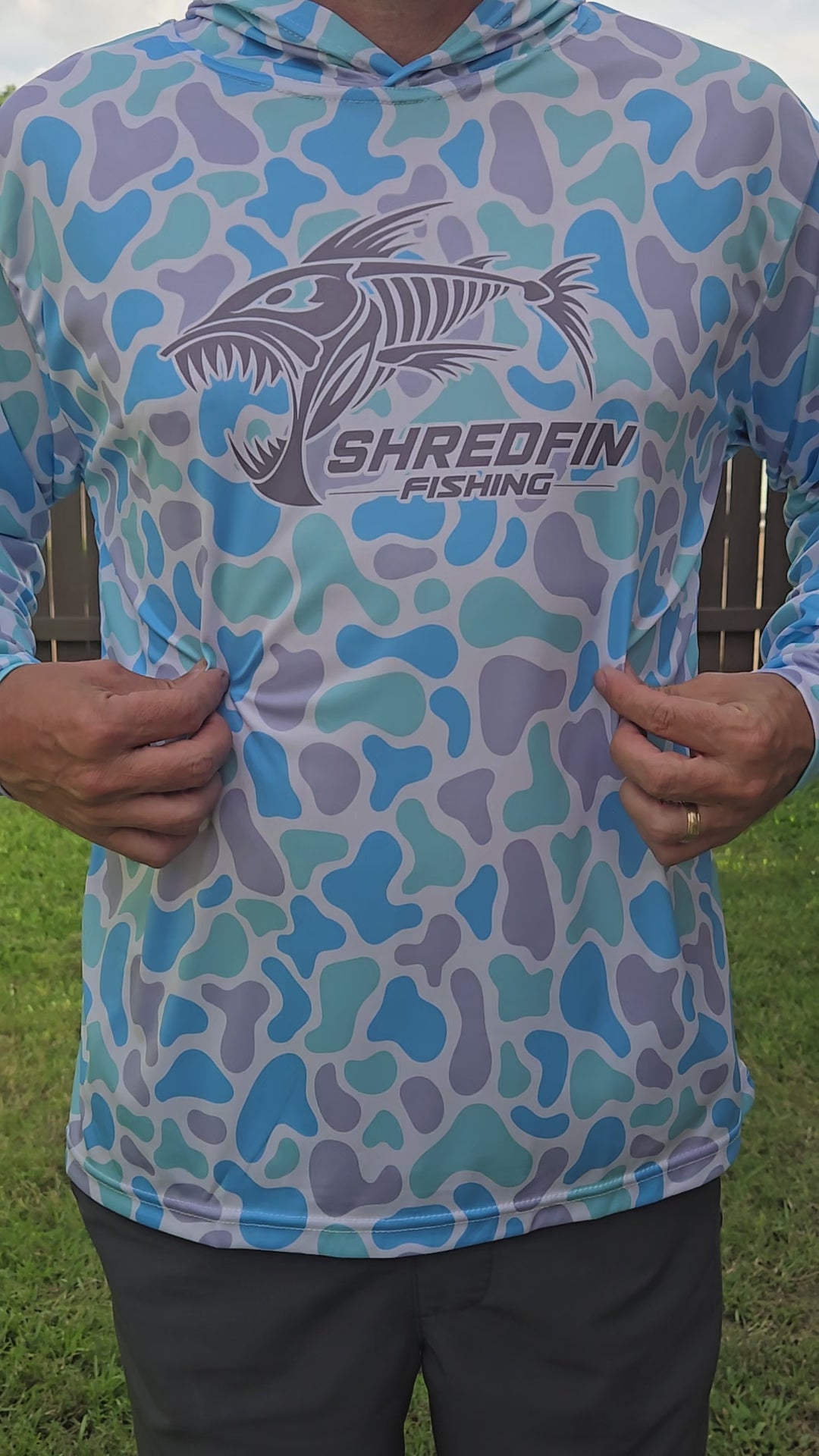 Video showing ShredFin Seaglass Camo hooded performance shirt.
